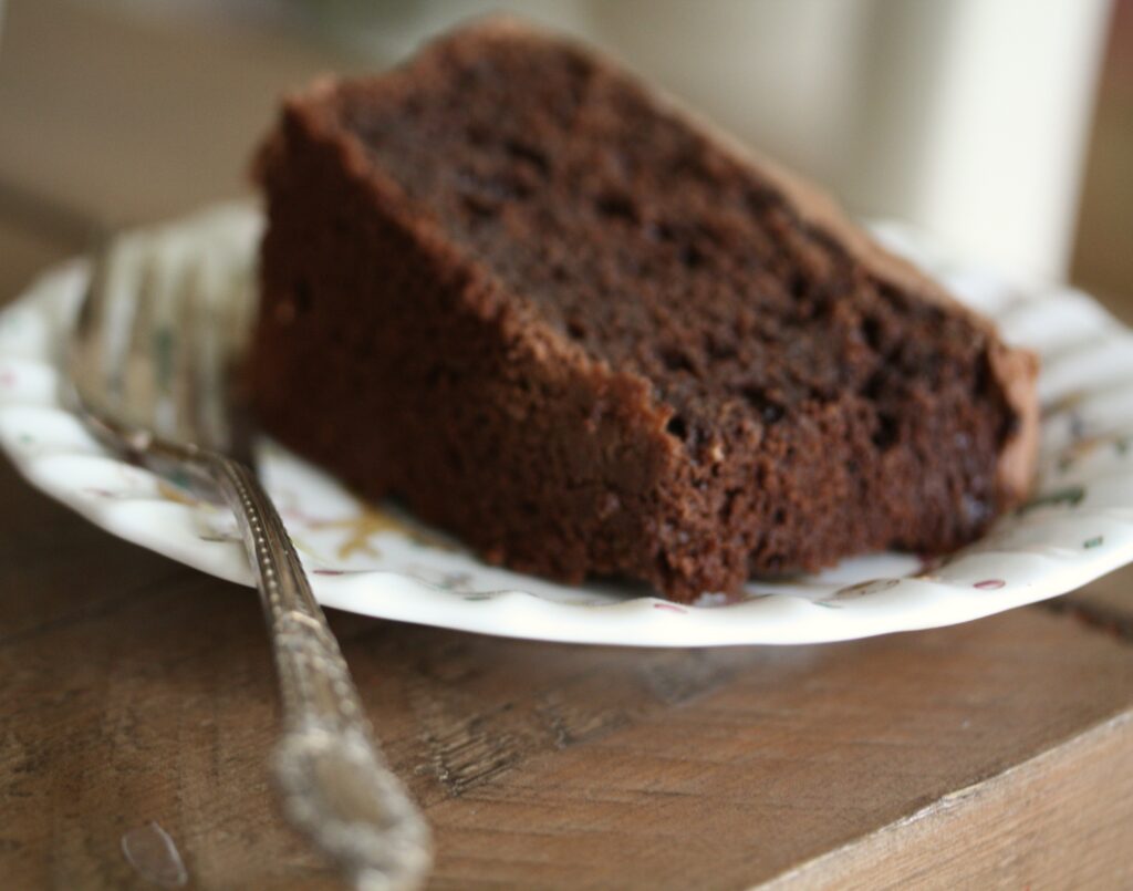 Slice of gluten-free oat flour chocolate cake.